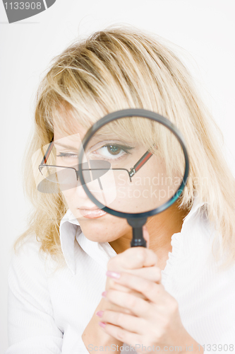 Image of girl with a magnifying glass
