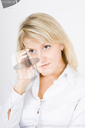 Image of beautiful girl talking on the phone