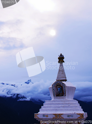 Image of White stupa under the sun