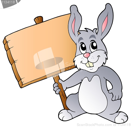 Image of Cute bunny holding wooden board