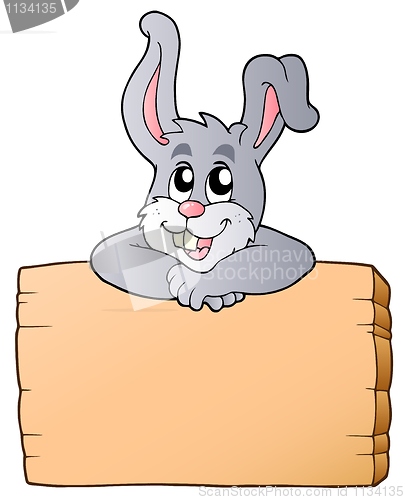 Image of Wooden board with lurking bunny