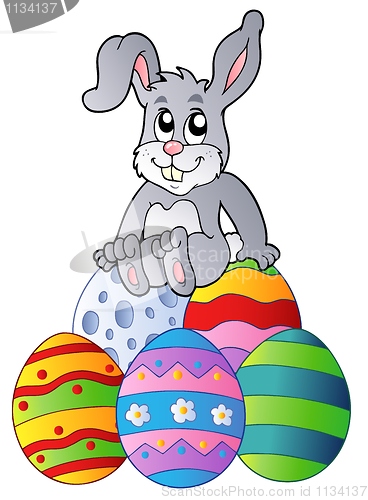 Image of Bunny on pile of Easter eggs