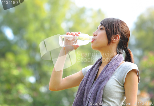 Image of woman drink water after sport