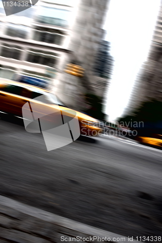 Image of Speeding Yellow Taxi Cab Motion Blur