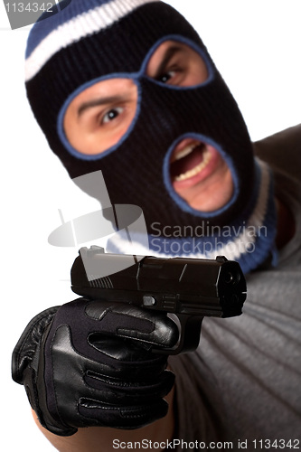 Image of Masked Criminal Points a Gun