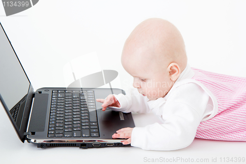 Image of little kid with a laptop