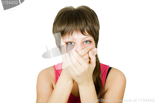 Image of girl closes her mouth with her hands