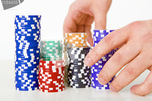 Image of poker chips and hands