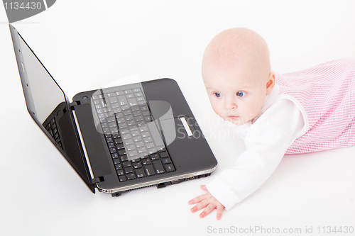 Image of baby with laptop