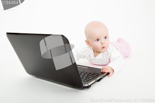 Image of infant with a computer