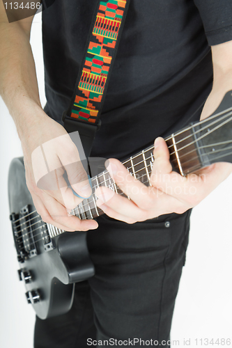Image of guitar. hands. musician