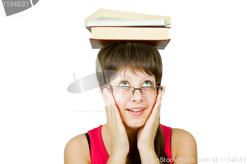 Image of girl in glasses with books on head