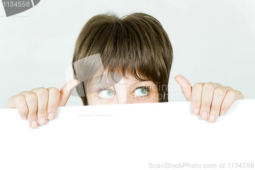 Image of young girl hiding