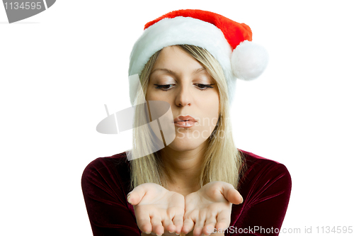 Image of portrait of a beautiful blonde in a Christmas hat on the isolate