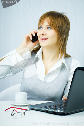 Image of happy business woman in the office