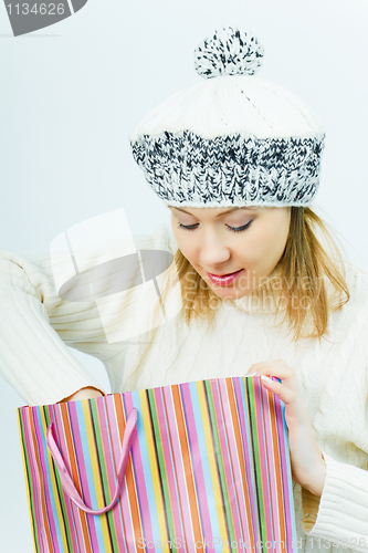 Image of girl wearing a winter cap. Winter Shopping