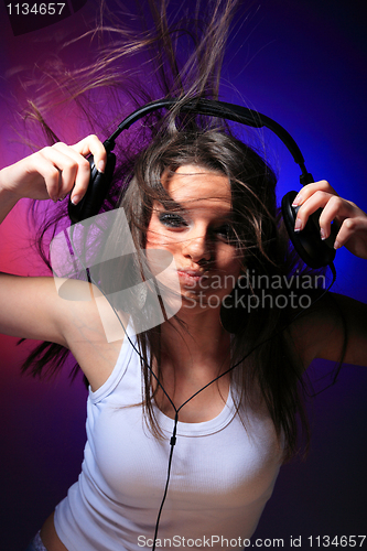 Image of girl enjoys music