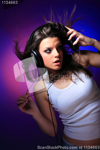 Image of girl enjoys music