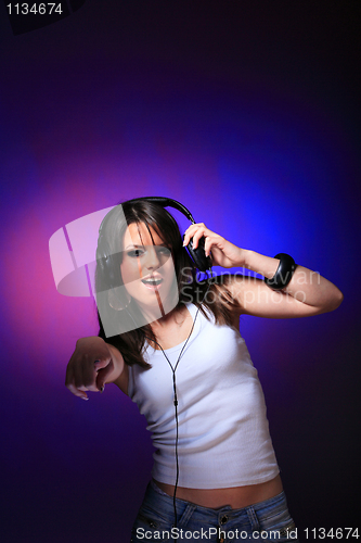 Image of girl enjoys music