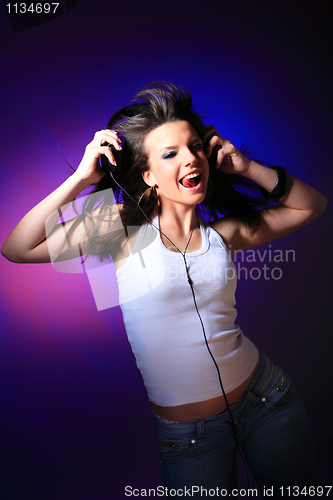 Image of girl enjoys music