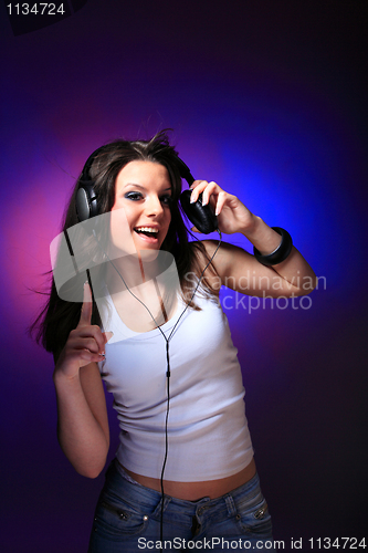 Image of girl enjoys music