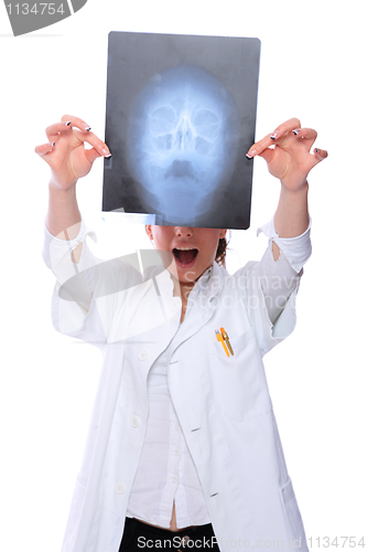 Image of Female doctor looking at an x-ray