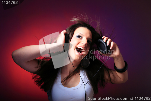 Image of girl enjoys music