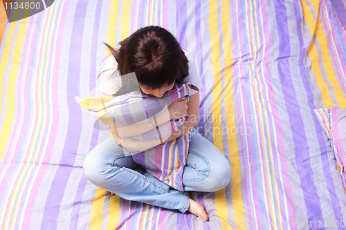 Image of woman in bed