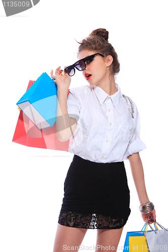 Image of Trendy young girl with a shopping bag