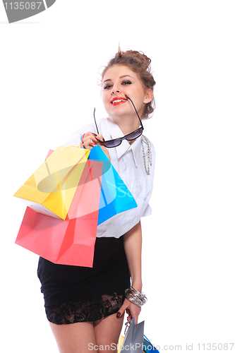 Image of Trendy young girl with a shopping bag