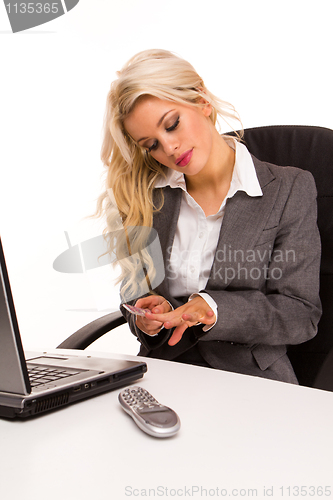 Image of Bored businesswoman in front of computer