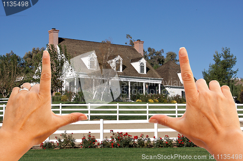 Image of Female Hands Framing Beautiful House