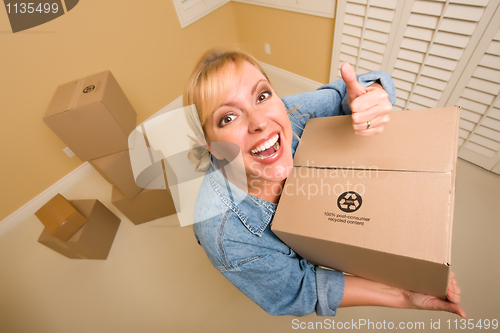 Image of Happy Thumbs Up Woman Moving Boxes