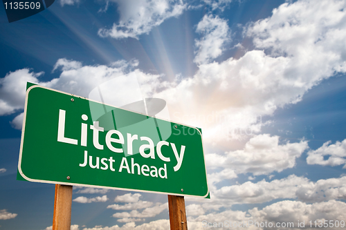 Image of Literacy Green Road Sign and Clouds