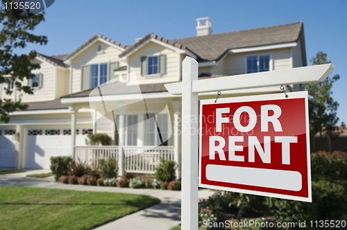 Image of For Rent Real Estate Sign in Front of House