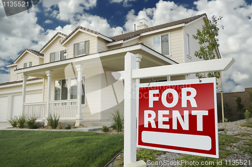 Image of For Rent Real Estate Sign in Front of House