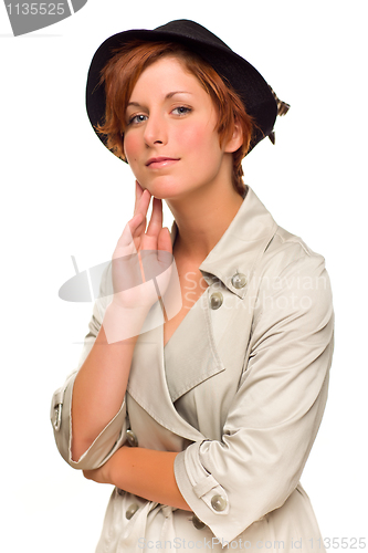 Image of Attractive Red Haired Girl Wearing a Trenchcoat and Hat