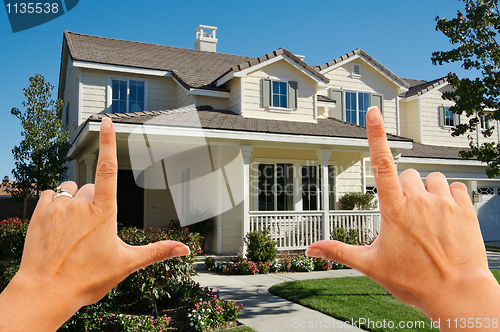 Image of Female Hands Framing Beautiful House