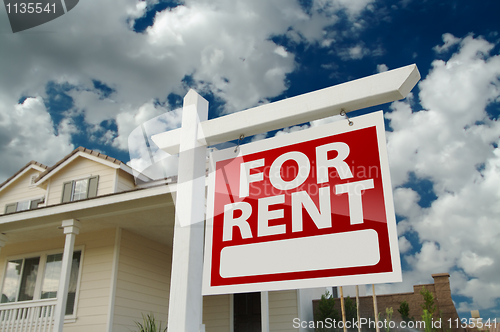 Image of For Rent Real Estate Sign in Front of House