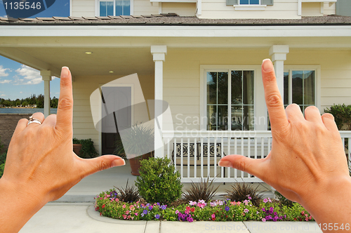 Image of Female Hands Framing Beautiful House