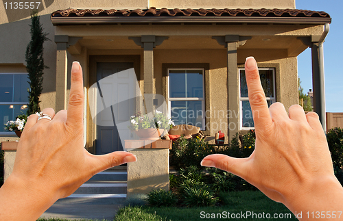 Image of Female Hands Framing Beautiful House