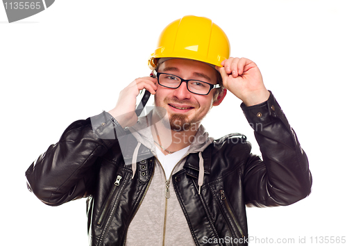 Image of Handsome Young Man in Hard Hat on Phone