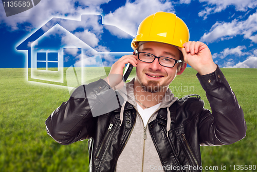 Image of Contractor in Hard Hat in Front of Ghosted House and Grass Field