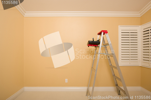 Image of Empty Room with Ladder, Paint Tray and Rollers