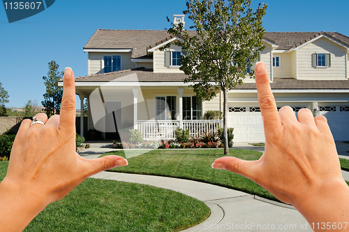 Image of Female Hands Framing Beautiful House