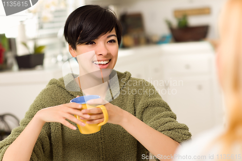 Image of Multi-ethnic Young Attractive Woman Socializing with Friend