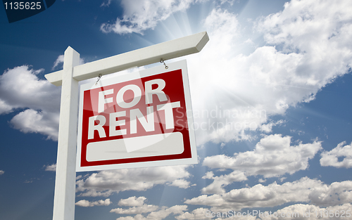 Image of Right Facing For Rent Real Estate Sign Over Sunny Sky