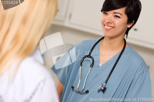 Image of Attractive Mixed Race Young Female Doctor Talking with Patient