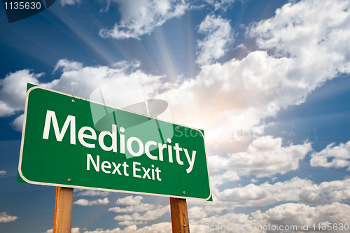 Image of Mediocrity Green Road Sign and Clouds