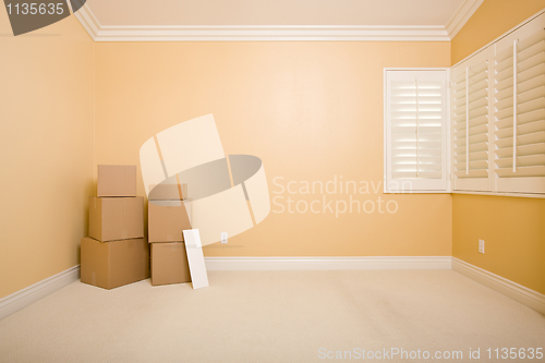Image of Moving Boxes and Blank Sign in Empty Room